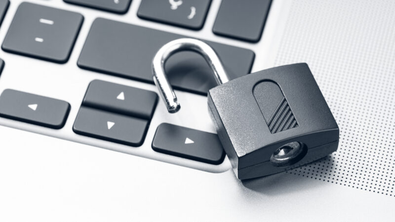 Open padlock on modern laptop. Computer Security Vulnerability concept