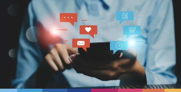 A,Person,Holding,A,Smartphone,With,Colorful,Notification,Icons,On